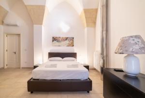 Posteľ alebo postele v izbe v ubytovaní Milestone Inn Lecce