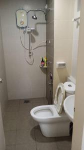 a bathroom with a shower and a toilet and a sink at Staycity Apartment - D'Perdana Sri Cemerlang in Kota Bharu