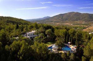 una vista aérea de una casa en los árboles en Seven Senses Luxury Hilltop villa with sea views, en Santa Eulària des Riu