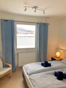 Postel nebo postele na pokoji v ubytování Apartments in Henån