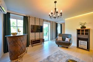 TV in/ali zabaviščno središče v nastanitvi Residenz Styrian Toskana Splendid