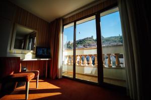 a hotel room with a view of a balcony at Sharden Villa Boutique Hotel in Tbilisi City