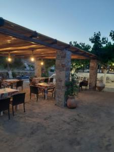 A restaurant or other place to eat at ISALOS ROOMS ON THE BEACH