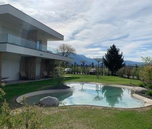 a house with a swimming pool in the yard at Pitla Cuna Eco Relais in Terlano