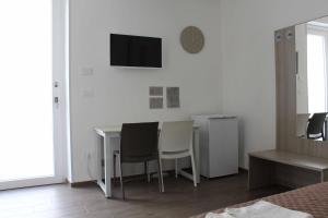 TV a/nebo společenská místnost v ubytování San Andreas Suites