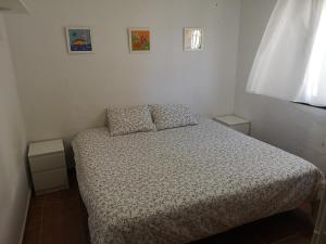 Łóżko lub łóżka w pokoju w obiekcie Casa Alma