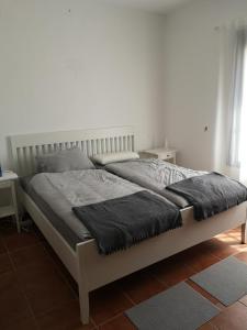 Łóżko lub łóżka w pokoju w obiekcie Casa Alma