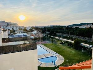 a view from the balcony of a building with a swimming pool at La Marina SeaView Penthouse in Sitges