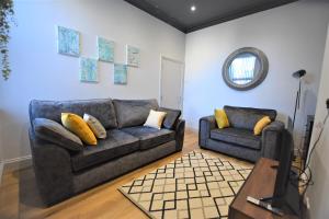 O zonă de relaxare la Dwell Living - Central 4 bedroom Contractor Family Friendly