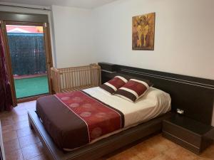 Postel nebo postele na pokoji v ubytování Apartamento con jardín privado y acceso a piscina