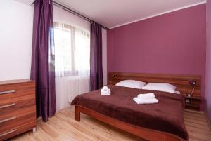 Posteľ alebo postele v izbe v ubytovaní Apartmany Sileas