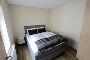 מיטה או מיטות בחדר ב-K16Apartments