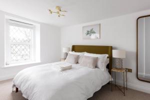 מיטה או מיטות בחדר ב-Luxe Design - Chic Cottage - Heart of Rothbury