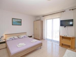 Postel nebo postele na pokoji v ubytování Apartmani Korljan
