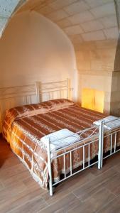 Ліжко або ліжка в номері Uliveto Sant' Isidoro