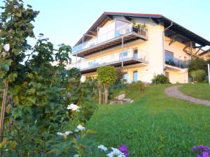 a house with a garden in front of it at Haus am Weinberg in Seekirchen am Wallersee