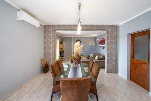 a dining room with a table and chairs at Apartment Thalia in Zadar