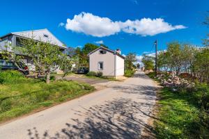 a dirt road with a house on the side at Apartment Thalia in Zadar