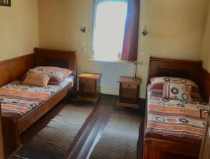 Кровать или кровати в номере Convoy Panzió