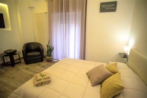 Postel nebo postele na pokoji v ubytování Corte Gattini Rooms
