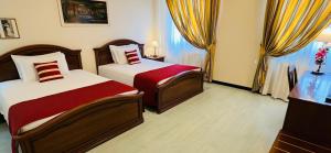 A bed or beds in a room at Albergo Italia