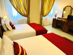 A bed or beds in a room at Albergo Italia