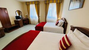 A bed or beds in a room at Albergo Italia