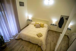 Postel nebo postele na pokoji v ubytování Corte Gattini Rooms