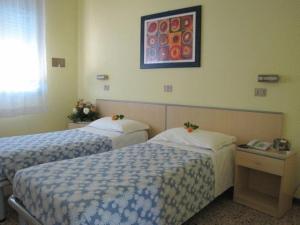 Postel nebo postele na pokoji v ubytování Hotel Senio