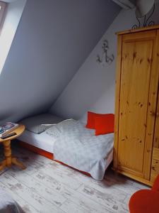 A bed or beds in a room at Apartament-Pokoje Gościnne u Natalii