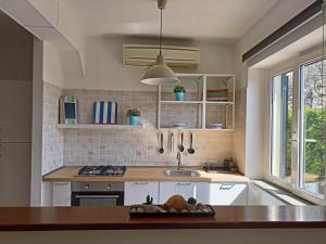 a kitchen with a sink and a counter top at Villa Rosaria in Vasto