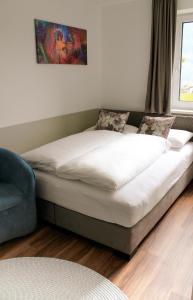 A bed or beds in a room at TheView Garden