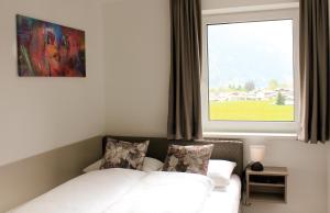 A bed or beds in a room at TheView Garden