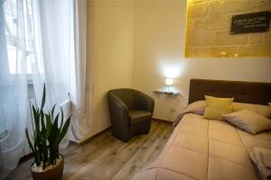 Postel nebo postele na pokoji v ubytování Corte Gattini Rooms