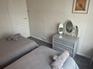 Un pat sau paturi într-o cameră la 11 Chester road Newquay