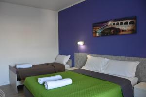 Postel nebo postele na pokoji v ubytování Venice Stay