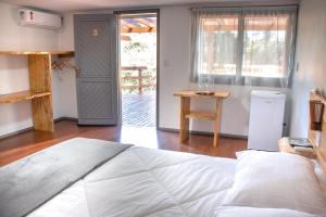 Postel nebo postele na pokoji v ubytování Refúgio Fortal