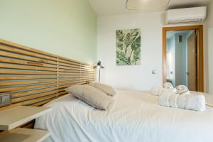 Posteľ alebo postele v izbe v ubytovaní Teatro Suites Málaga CITY FLAT