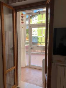a sliding glass door with a view of a building at mineVaganti in Ancona