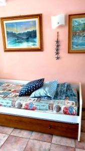 A bed or beds in a room at La Pianotta Sulla Spiaggia