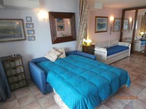 A bed or beds in a room at La Pianotta Sulla Spiaggia