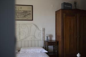 Llit o llits en una habitació de B&B Agriturismo Casa Vallona