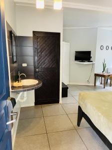 TV o dispositivi per l'intrattenimento presso Lizard King Hotel & Suites