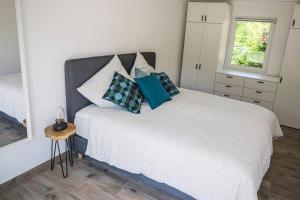 Giường trong phòng chung tại Hohwaii Cottage