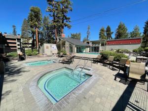 a swimming pool in a yard with a swimming pool at Lakeview 826 Condo #108 Condo in Mammoth Lakes
