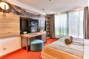 Postel nebo postele na pokoji v ubytování Carine Hotel Centar