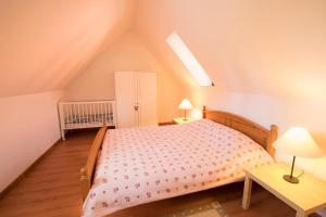 Ліжко або ліжка в номері Les Bains de Rosheim