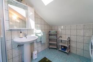 a bathroom with a sink and a mirror at Apartment Nada in Petrcane +46 photos