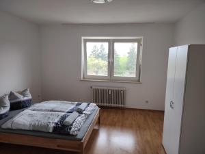 Tempat tidur dalam kamar di Domblick Regensburg