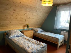 Krevet ili kreveti u jedinici u okviru objekta A&R Kaszuby Natura Dom Wypoczynek